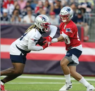  ?? Photo by Joe Jacobs ?? Patriots rookie quarterbac­k Jarrett Stidham, right, is excited to be Tom Brady’s backup this season after coach Bill Belichick cut veteran Brian Hoyer Saturday.