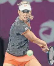  ?? AP ?? Belgium’s Elise Mertens in action against Romania's Simona Halep in the final of the Qatar Open on Saturday.