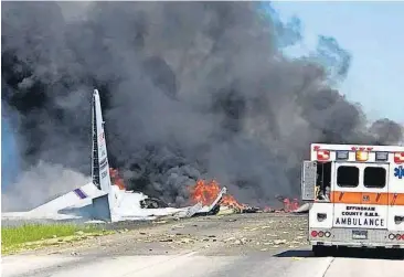  ?? [AP PHOTO] ?? Flames and smoke rise from an Air National Guard C-130 cargo plane after it crashed Wednesday near Savannah, Ga.