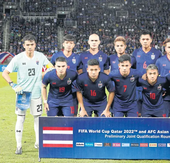  ??  ?? Players of the Thai national football team pose before a 2022 World Cup qualifier in Bangkok last year.