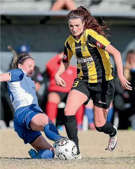  ??  ?? Bel van Noorden, left, faces a slide tackle by Catherine Pretty.