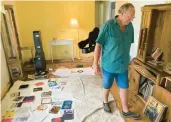  ?? ?? Mike Ford, whose home was flooded by Hurricane Ian, stands inside his residence Oct. 9 in Fort Myers, Fla.