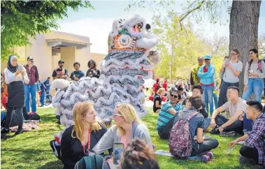  ?? ROBERTO E. ROSALES/JOURNAL ?? Dozens of student and community groups converged at the University of New Mexico on Thursday for the annual Internatio­nal Festival. Pictured is one of four dragons of the Van Hanh Chinese Lion Dance.