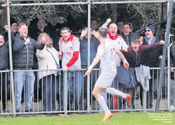  ??  ?? United’s Duncan Culley celebrates one of his goals with fans on