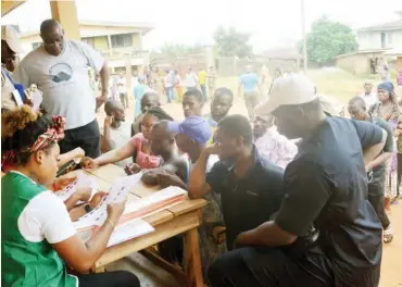  ?? PHOTO: NAN ?? Voters being screened at Eri Primary School polling unit 004 in Aguleri, during the Governorsh­ip Election in Anambra yesterday