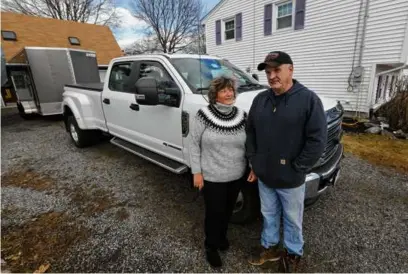  ?? PAT GREENHOUSE/GLOBE STAFF ?? After the Andersons’ car insurance premium surged following an at-fault accident, they decided to shop around and found a policy with another insurance company at a lower