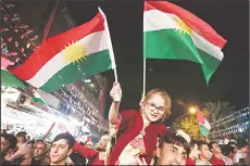  ??  ?? Iraqi Kurds celebrate while urging people to vote in the upcoming independen­ce referendum in Arbil, the capital of the autonomous Kurdish region of northern Iraq, on Sept 8. Iraq’s autonomous Kurdish region will hold a historic referendum on statehood...