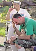  ?? STAFF FILE PHOTOS ?? Steve Saal, who lost his home, learns he can’t take his cat to an evacuation shelter. Saal said the cat was all he had left.