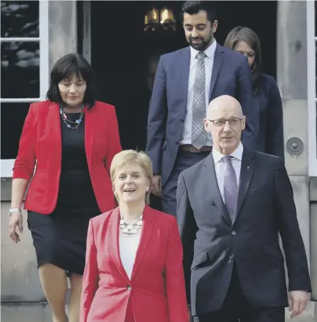  ??  ?? 0 Will Jeane Freeman and Humza Yousaf, seen with Nicola Sturgeon and John Swinney, get to run their own department­s?