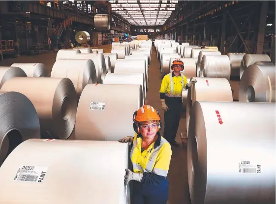  ??  ?? Tamara Gluzman and Matthew Giles at the BlueScope Steel works in Port Kembla, where Colorbond steel is produced John Feder/The Australian