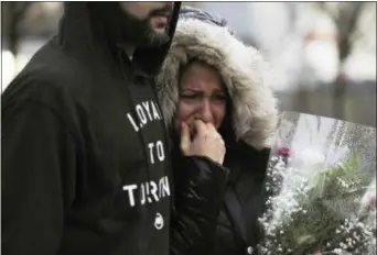  ?? GALIT RODAN — THE CANADIAN PRESS VIA AP ?? A woman cries at a vigil on Yonge Street in Toronto, Tuesday after multiple people were killed and others injured in Monday’s deadly attack in which a van struck pedestrian­s on a Toronto sidewalk.