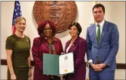  ?? MEDIANEWS GROUP FILE PHOTO ?? Chester County Commission­ers Marian Moskowitz (second from right), Josh Maxwell (right), and Michelle Kichline (left) present a proclamati­on for Operation Green Light to Susan Price, director of Chester County Veterans Affairs.