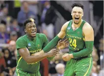  ?? CHARLIE RIEDEL/ASSOCIATED PRESS ?? Dylan Ennis, left, and teammate Dillon Brooks celebrate as Oregon is headed to the Final Four for the first time since 1939.