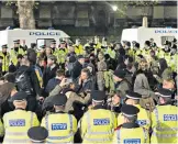  ??  ?? Kettling at the Houses of Parliament, above: Waddington observed that it worked through ‘boredom rather than fear’