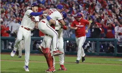  ?? Photograph: Jason Szenes/EPA ?? The Philadelph­ia Phillies celebrate after defeating the San Diego Padres to reach the World Series.