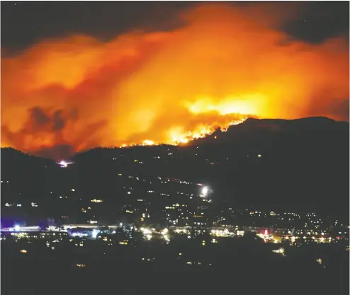  ?? Jim Urquhart / reuters files ?? The Cameron Peak Fire, the largest wildfire in Colorado’s history, burns on Oct. 16. Investors can stand to benefit
from the global shift to a low- carbon economy, write David Rosenberg and Marius Jongstra.