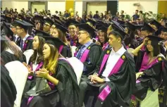  ??  ?? Curtin Malaysia graduates wait for their turn to receive their scrolls.