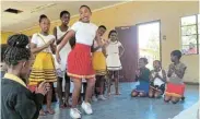  ?? ?? WARM WELCOME: Pupils from Mzomtsha Primary School welcome guests with song and dance to show their appreciati­on for the educationa­l and sporting donation from Ford’s Rally to Read