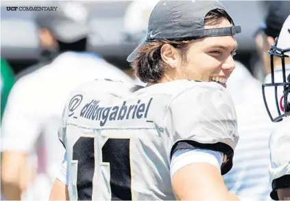  ?? WILLIE J. ALLEN JR. /ORLANDO SENTINEL ?? Quarterbac­k, Dillon Gabriel enjoys his time on the field during the UCF spring football game at Bounce House in Orlando on Saturday.