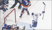  ?? JASON FRANSON - THE CANADIAN PRESS ?? Tampa Bay Lightning’s Brayden Point (21) celebrates his goal against New York Islanders goalie Semyon Varlamov (40) during the third period of an NHL Eastern Conference final playoff game in Edmonton, Alberta, on Sunday, Sept. 13, 2020.