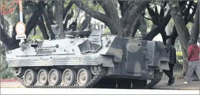  ?? PICTURE: AP ?? An armoured car on a street in Harare this week as Robert Mugabe bowed out. Emmerson Mnangagwa has been sworn in in his place.a reader doubts that the country is in for much better days.