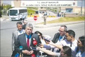  ?? AP/EMRE TAZEGUL ?? Philip Kosnett, the U.S. Embassy Charge d’Affaires, talks to members of the media Wednesday after attending the trial of jailed U.S. pastor Andrew Craig Brunson at a court inside the prison complex in Aliaga, Turkey.