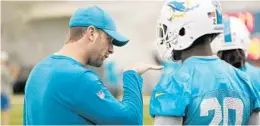  ?? WILFREDO LEE/AP ?? Miami Dolphins head coach Adam Gase, left, talks to safety Reshad Jones (20) during an NFL-organized team activities football practice on Thursday.