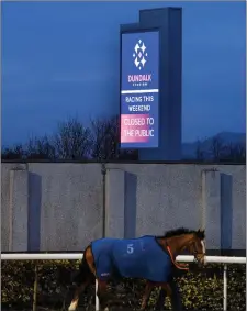  ??  ?? A view ofasign outside Dundalk Stadium announcing a closure of the racecourse to the public following directives from the Irish Government and the Department of Health in an effort to contain the spread of the Coronaviru­s (COVID-19).