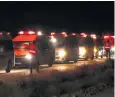  ??  ?? A convoy of buses and ambulances transporte­d Isil fighters and their families