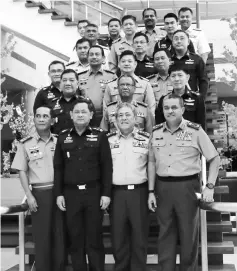  ??  ?? (On the front row) Sabri (second right) and Srisuwan (second left) in a group photo with delegates from Thailand. Also seen are Zaki (right) and Azizan (left).