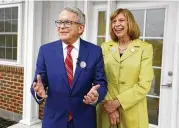  ?? PAUL VERNON / ASSOCIATED PRESS ?? Gov. Mike Dewine and first lady Fran Dewine leave their polling place after voting in Cedarville May 3. According to ethics disclosure­s that were due on Monday, Dewine owns stock in Intel.