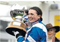  ??  ?? Winning smiles: Bryony Frost rides Frodon to victory (main picture), and with the Ryanair Chase trophy (right)