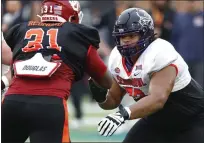  ?? BUTCH DILL — THE ASSOCIATED PRESS ?? American offensive lineman Steve Avila of TCU (79) runs through drills during practice for the Senior Bowl NCAA game, Feb. 2, in Mobile, Ala..