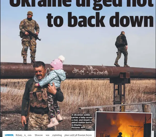  ?? ?? A Ukrainian soldier carries a baby across a river, and (inset) a petrol station burns in Kharkiv. Pictures: AFP