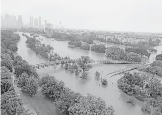  ?? Karen Warren / Houston Chronicle file ?? The Harris County Flood Control District is exploring building an undergroun­d tunnel system to drain stormwater to prevent the floods that occurred during Hurricane Harvey last year.