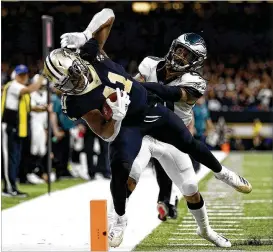  ?? JONATHAN BACHMAN / GETTY IMAGES ?? Alvin Kamara (pushed out of bounds in last weekend’s playoff win) acknowledg­es he benefits with Mark Ingram also carrying for the Saints.