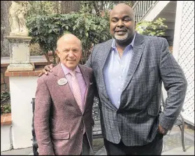  ?? JENNIFER BRETT / AJC ?? Chick-fil-A CEO Dan Cathy (left) stands with African American Film Critics Associatio­n president Gil Robertson. AAFCA honored Cathy with its 2017 AAFCA Film Icon Award.