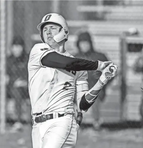  ?? NICK KING/LANSING STATE JOURNAL ?? Okemos’ Caleb Bonemer swings at a Mason pitch during the seventh inning on April 5 at Mason High School.