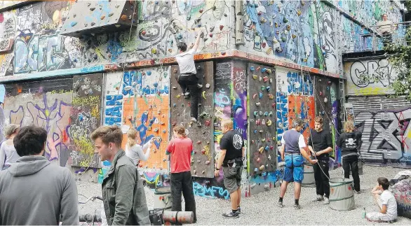  ?? RICK STEVES ?? Hamburg creatively recycles its urban past: This graffiti-covered bunker from the Second World War is now the largest climbing wall in the city.