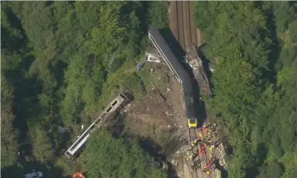  ??  ?? The 6:38am Aberdeen to Glasgow service came off the tracks and slid down an embankment near Carmont. Photograph: AP/Sky News