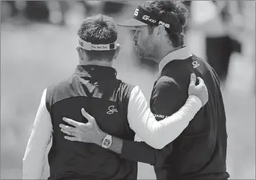  ?? JULIE JACOBSON/AP PHOTO ?? Bubba Watson, right, jokes around with Louis Oosthuizen while posing for a photo after a practice round for the U.S. Open on Monday at Shinnecock Hills in Southampto­n, N.Y.