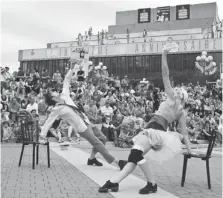  ?? PAUL CHIASSON/THE CANADIAN PRESS ?? To the delight of tourists and residents, many of Montreal’s summer festivals spill out onto streets, including this performanc­e by Oppo at a Montreal Internatio­nal Jazz Festival. The city has three dozen festivals from June to September with something...