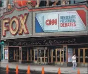  ?? Scott Olson Getty Images ?? THE FIRST 10 Democratic presidenti­al hopefuls will debate at Detroit’s Fox Theater on Tuesday.