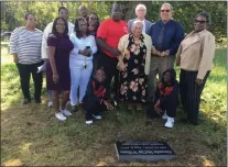  ?? MEDIANEWS GROUP FILE PHOTO ?? Family members of Alexander McClay Williams gather at his grave site. The family finally was able to put a proper grave marker on the site.