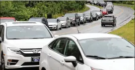  ?? NEWS & OBSERVER VIA AP ?? Cars line up for gas Wednesday at Costco in Apex, N.C., as many gas stations have run out of fuel during what analysts say is unwarrante­d panic-buying.