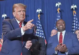  ?? WIN MCNAMEE/GETTY IMAGES ?? Former U.S. Sen. Tim Scott, right, who once competed against Donald Trump for the 2024 Republican nomination, ultimately hit the campaign trail for his former rival in New Hampshire and South Carolina.