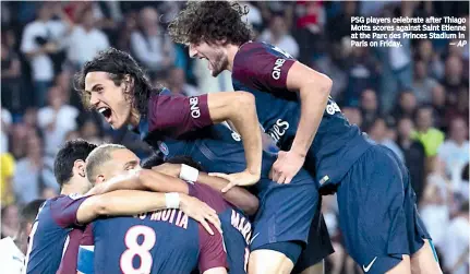  ?? — AP ?? PSG players celebrate after Thiago Motta scores against Saint Etienne at the Parc des Princes Stadium in Paris on Friday.