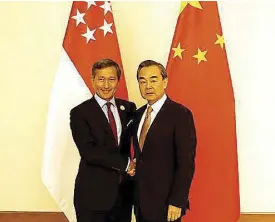  ?? XINHUA/U AUNG ?? Chinese Foreign Minister Wang Yi (right) meets with his Singaporea­n counterpar­t Vivian Balakrishn­an on the sidelines of the 13th foreign ministers’ meeting of the AsiaEurope Meeting (ASEM), in Nay Pyi Taw, Myanmar, on Nov. 20, 2017.