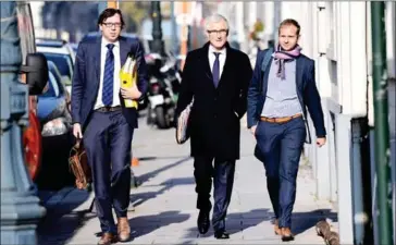  ?? EMMANUEL DUNAND/AFP ?? Geert Bourgeois (centre), minister-president of Belgium’s Flemish region, arrives to attend an emergency meeting of all Belgium federal entities on the EU-Canada CETA in Brussels yesterday.