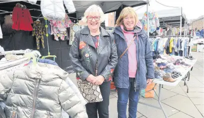  ?? Steve Allen ?? ●●Barbara Davis (left) has run her children’s clothing stall for 21 years and Beverley Evans, who says she will ‘feel sick’ on the last day after trading on Rochdale market for 30 years
